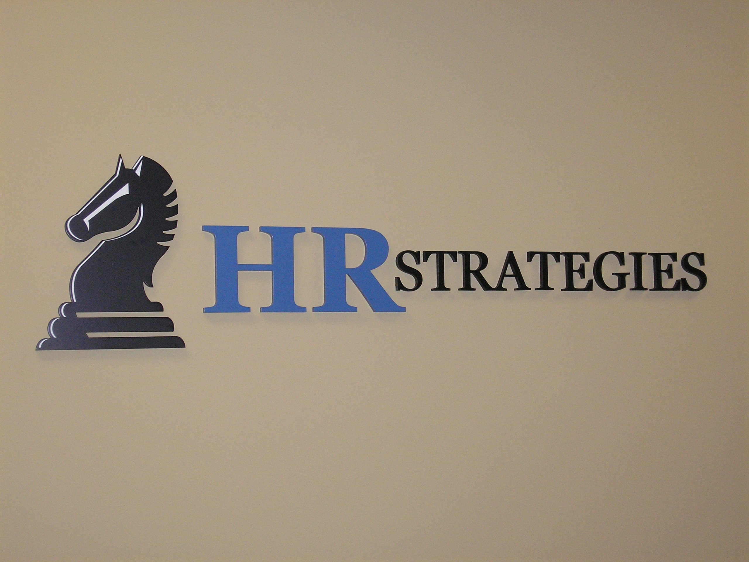 Finished HR Strategies Logo behind reception
